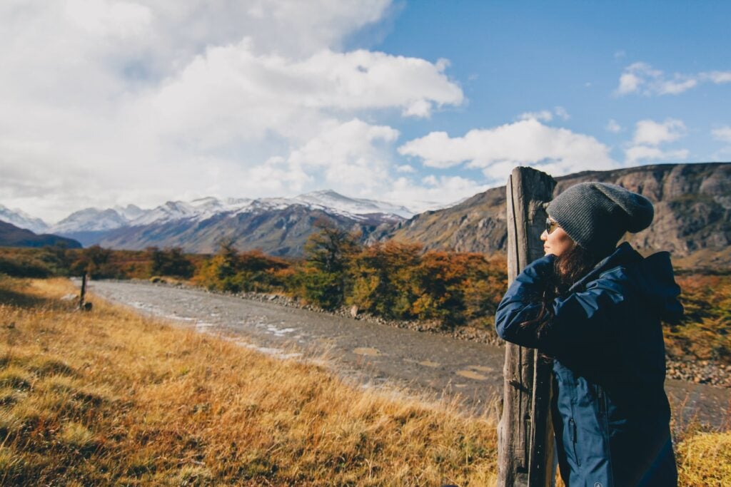 Woman on a trail looking out over the Patagonian landscape