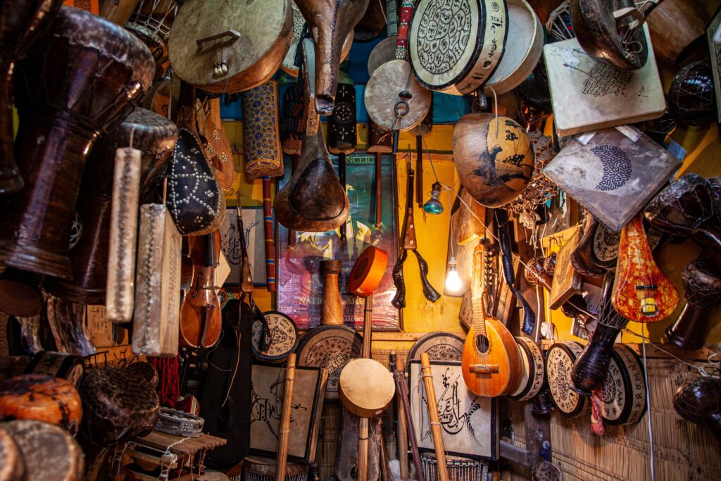 Handmade wooden instruments handing on a wall in a market Essaouira, Morocco