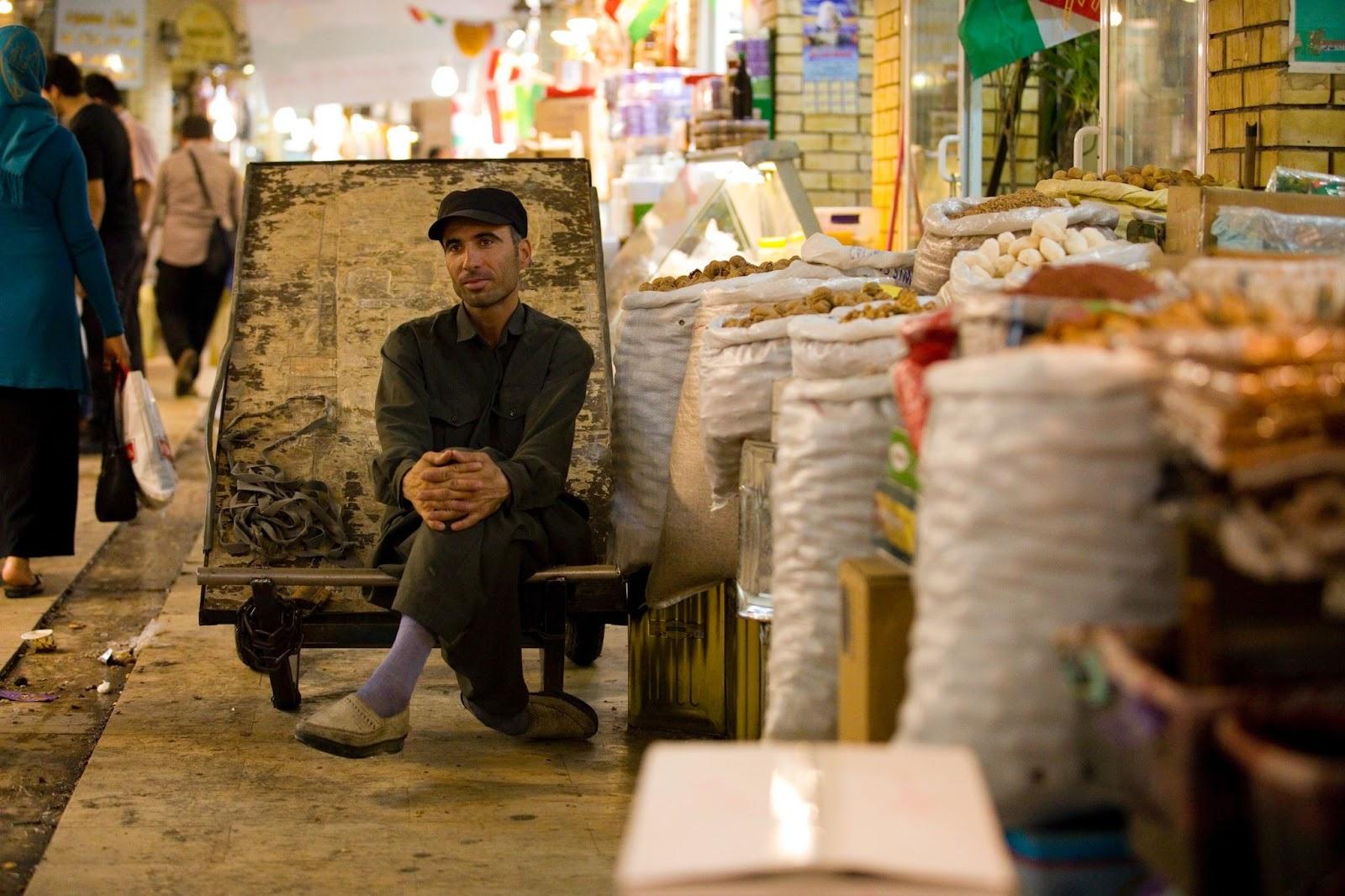 Street seller sat on his wooden cart in Erbil, market and bazaar