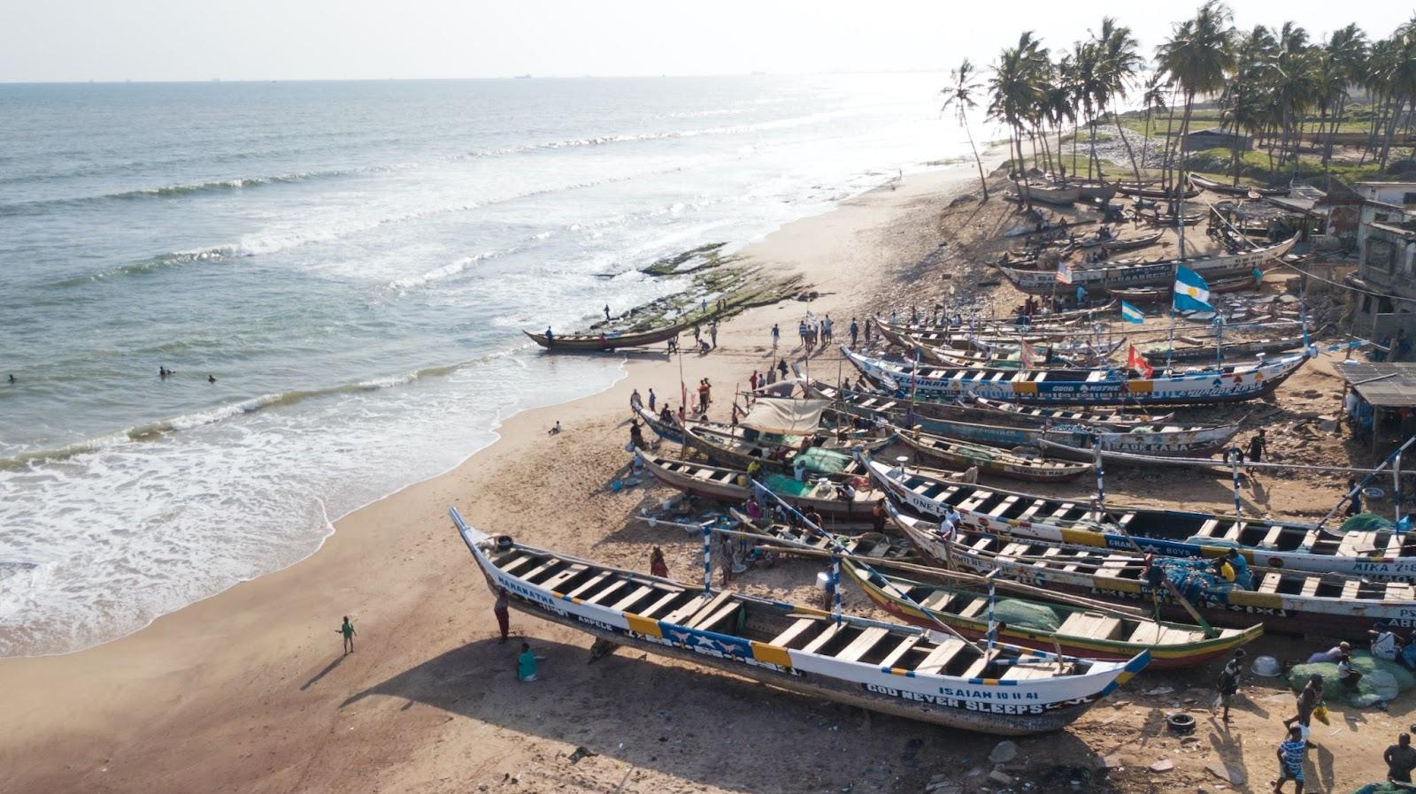 Fishermen repairing their boats on the beach after a days fishing