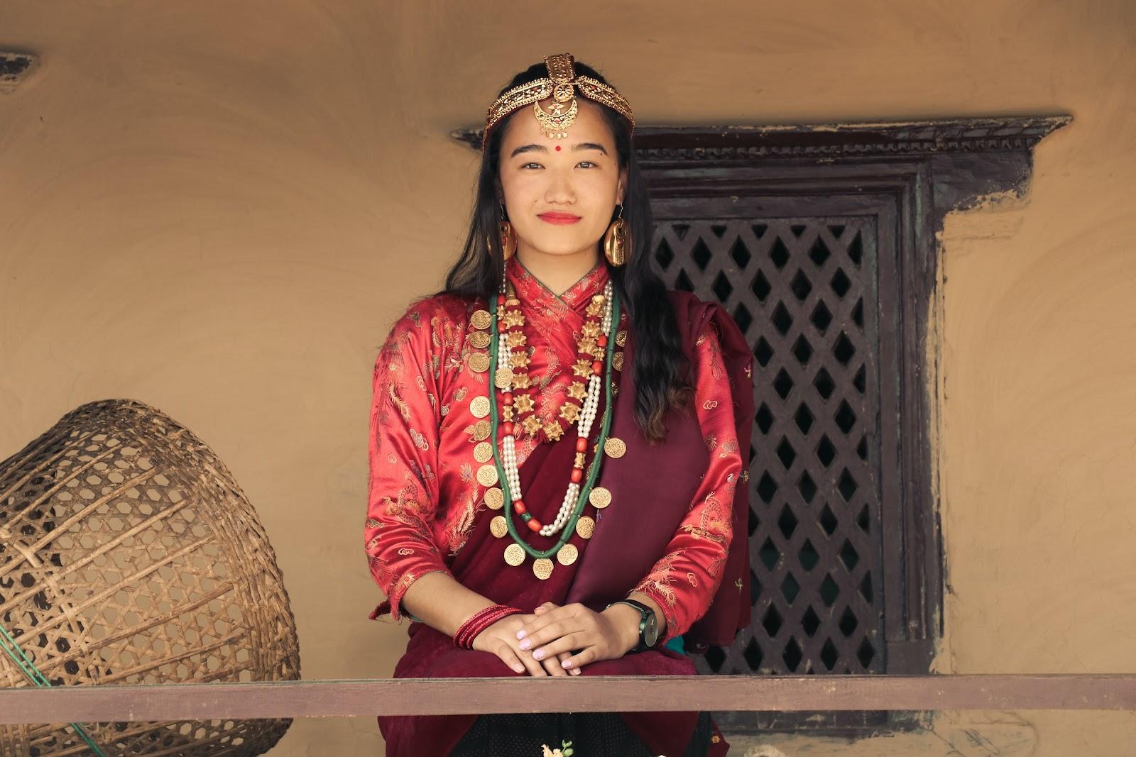 A Nepalese woman wearing traditional clothes and accessories.