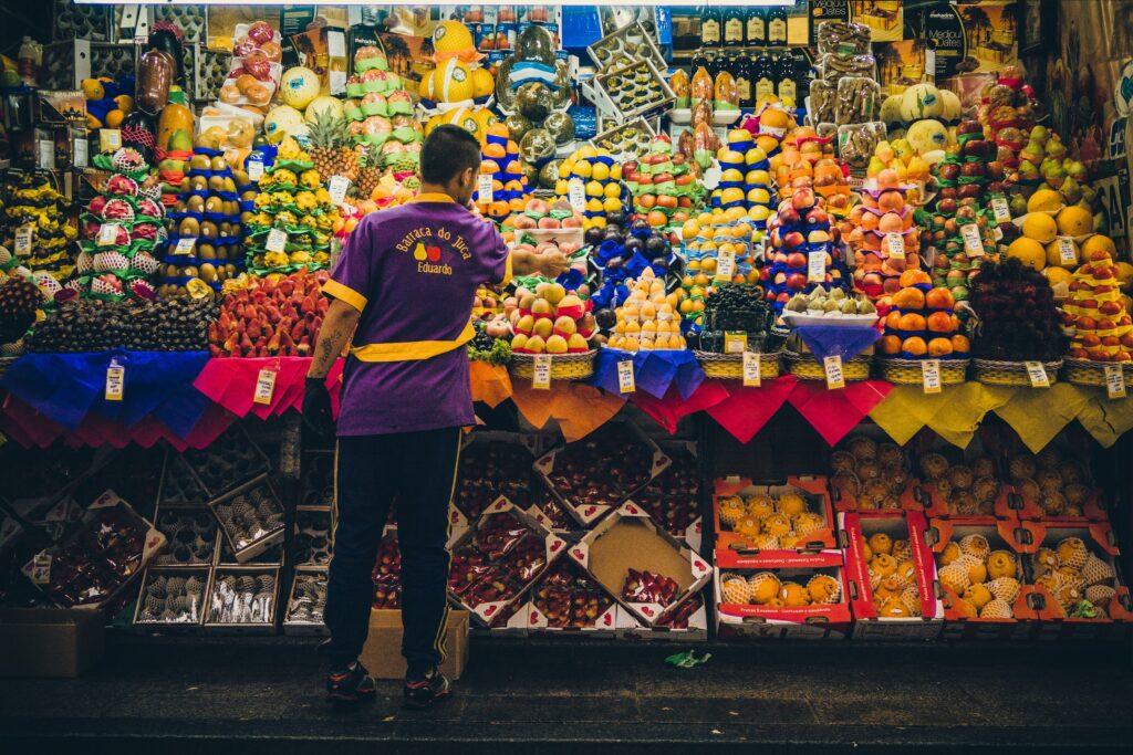 a local vendor selling a variety of fruit on the streets of Brazil.