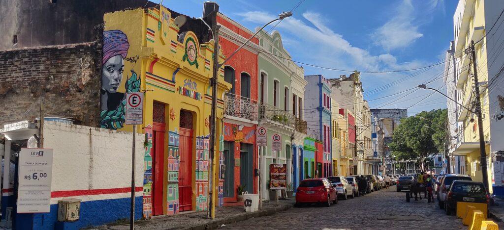 Colourful buildings decorated with wall art in the city of Recife.