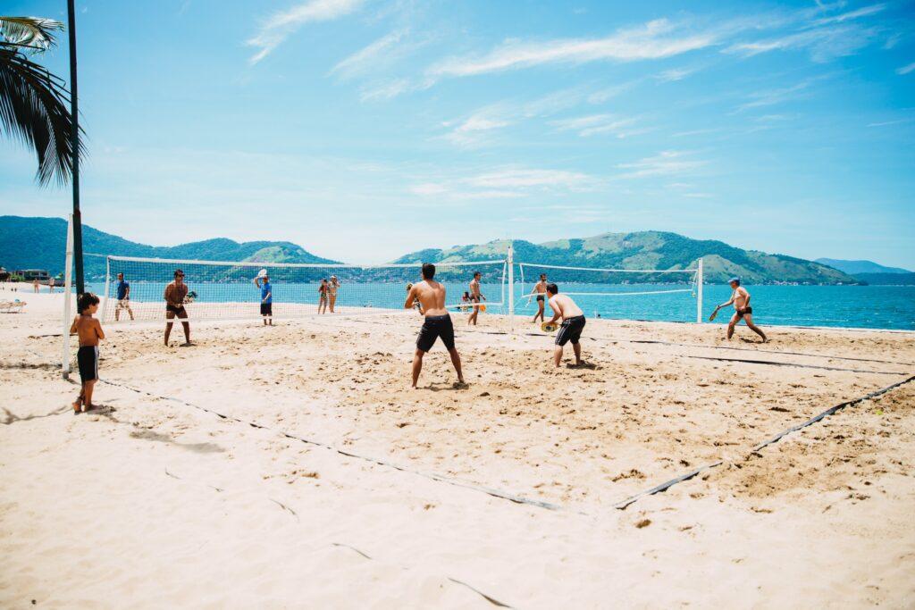 People playing volleyball on a beach in Rio de Janeiro