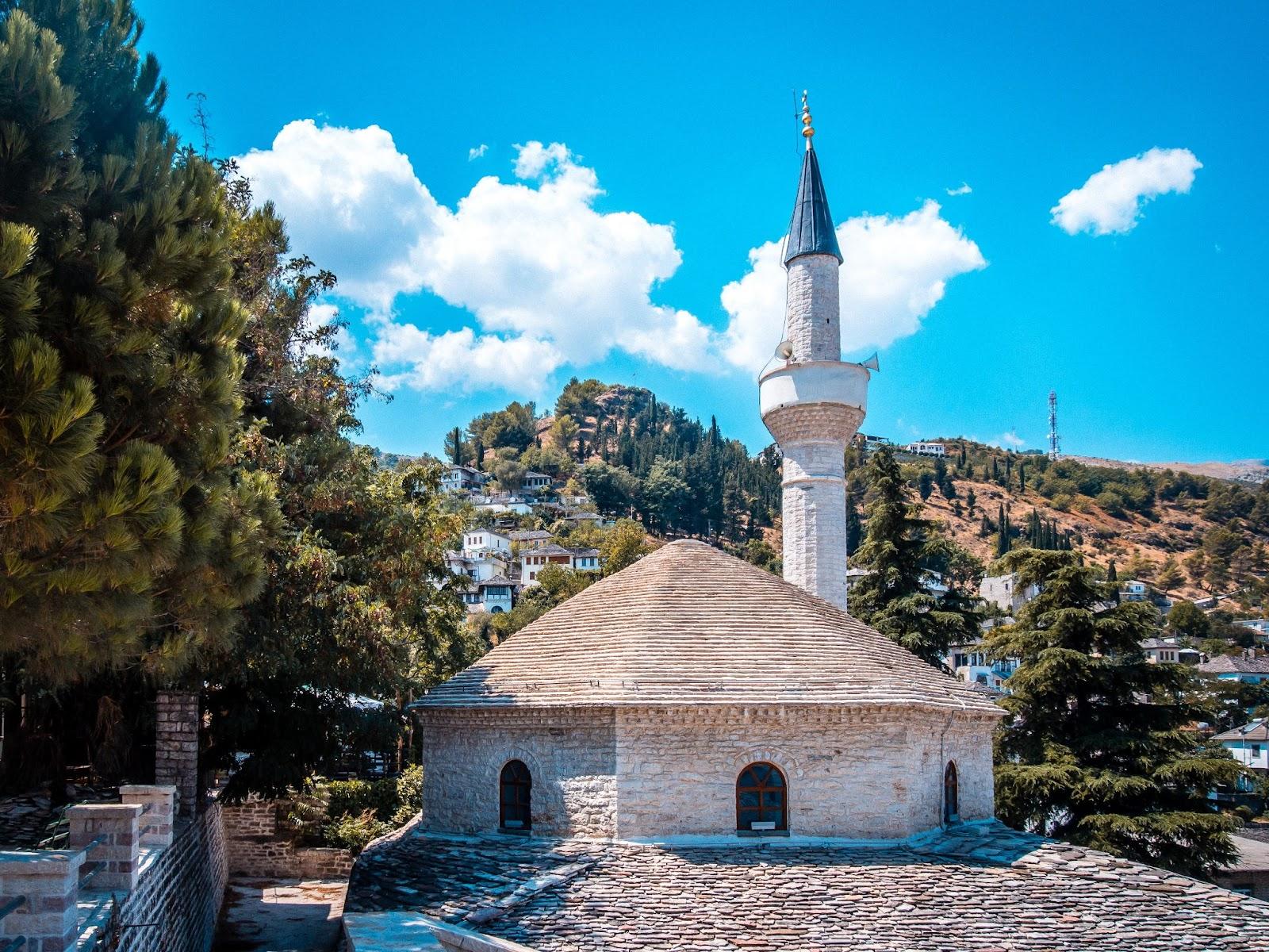 An Albanian church on the side of a hill.