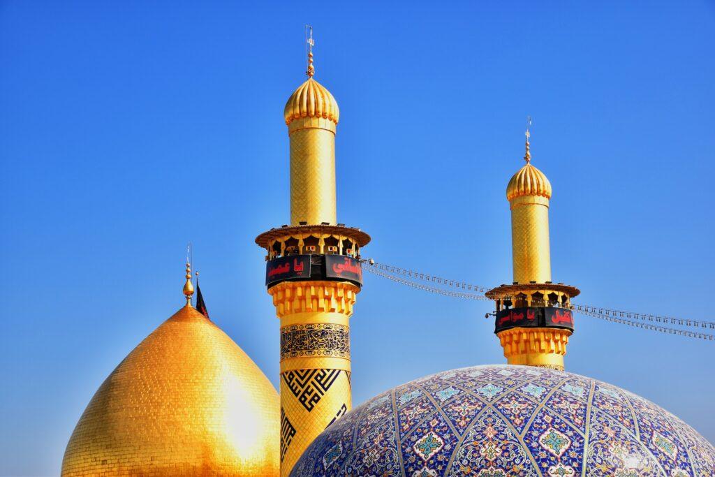The tops of the domes of the Imam Hussain Mosque.