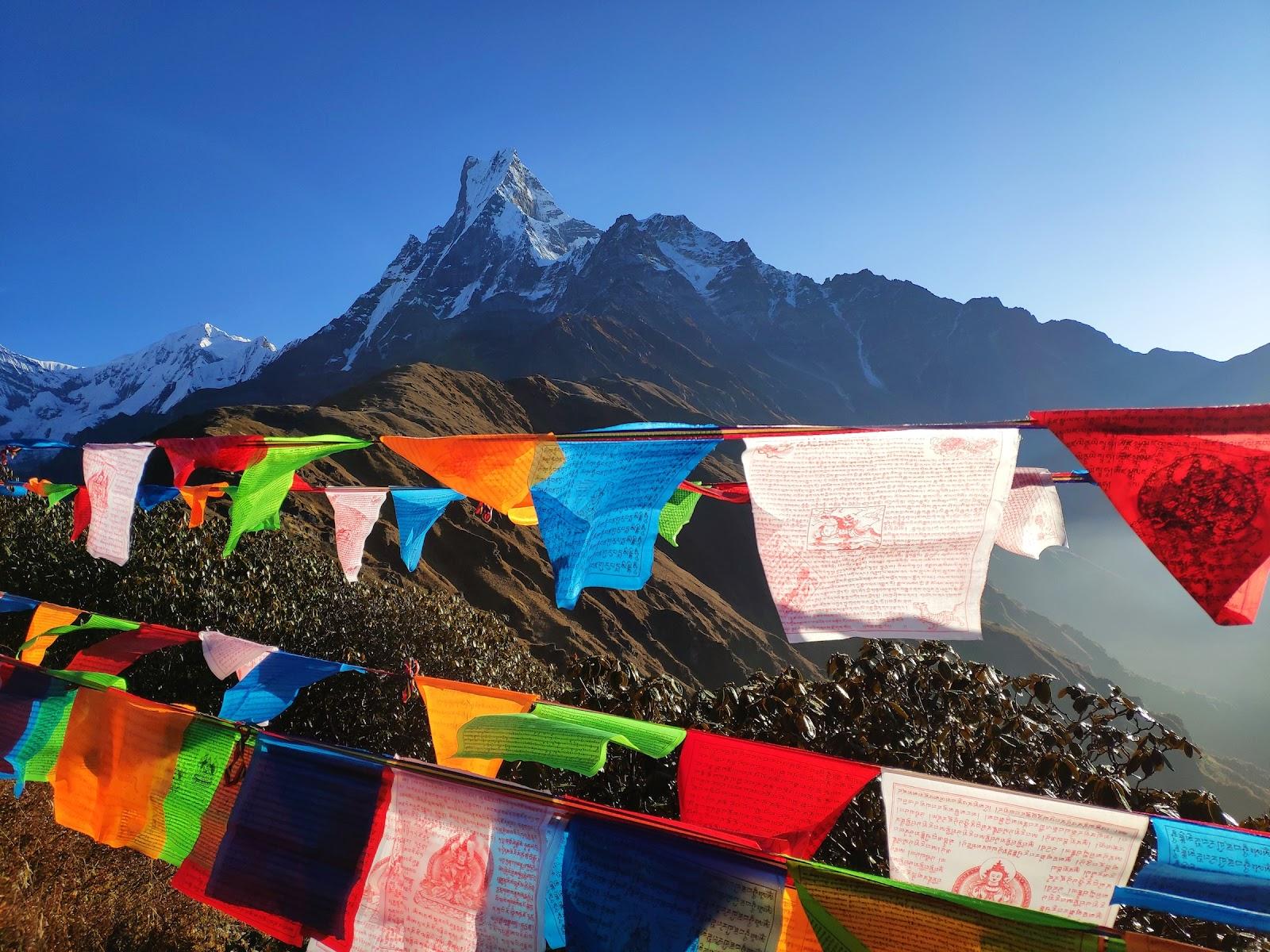 Mardi Himal, a mountain range in Nepal, adorned with colourful prayer flags.