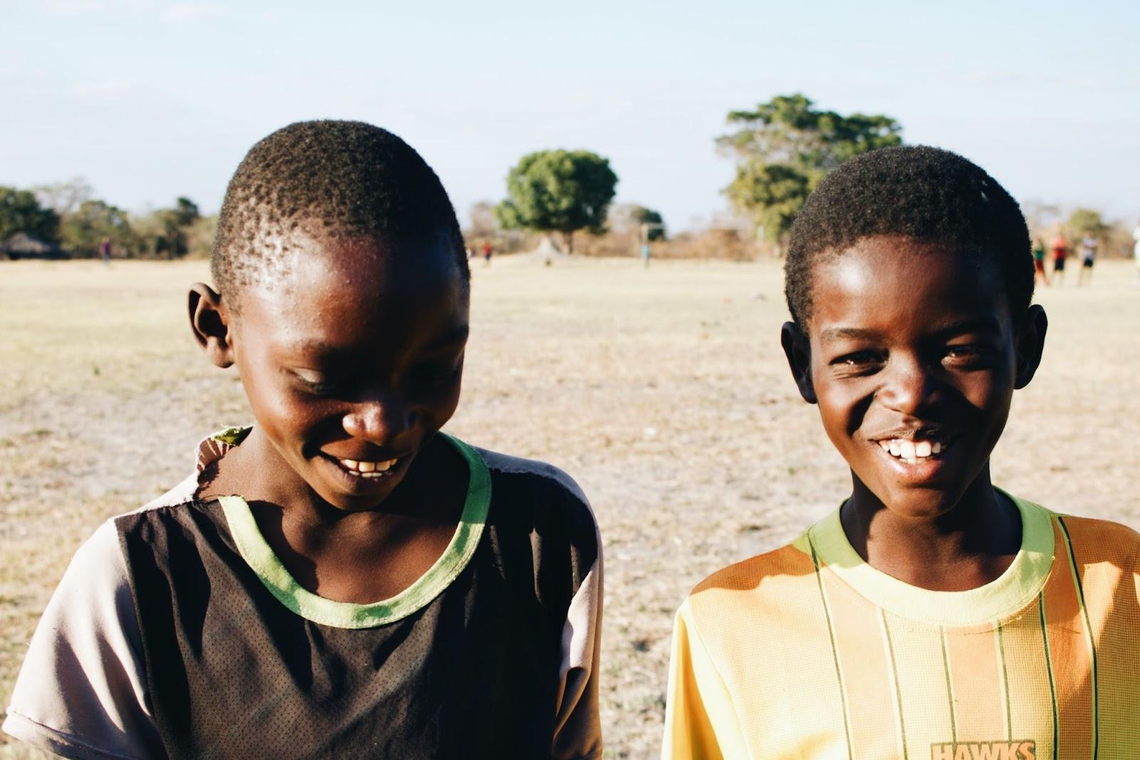 Two Zambian children smiling for a photograph