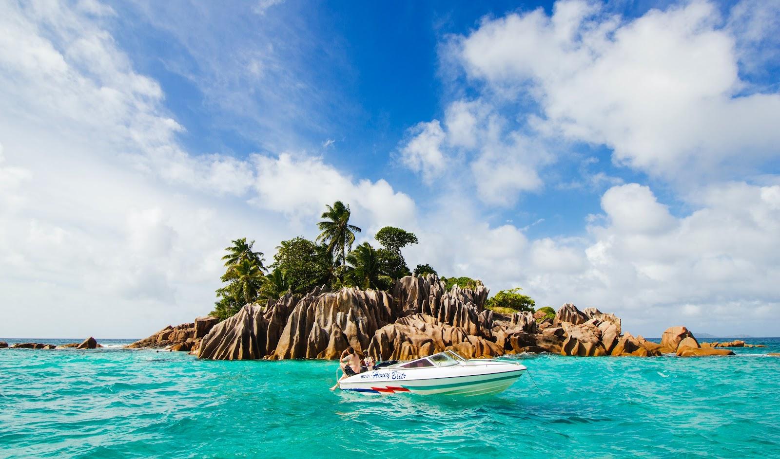 A perfect tropical island and a speed boat.