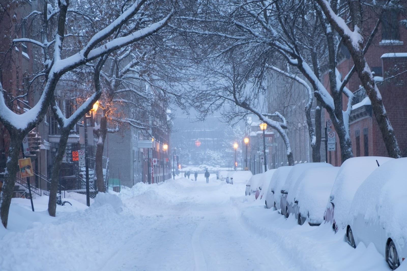 View down a street in Montreal, Canada in Winter - deep snowfall 