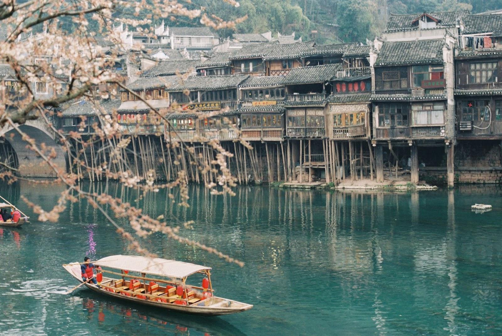Boat on the river in Pheonix Ancient Town in China