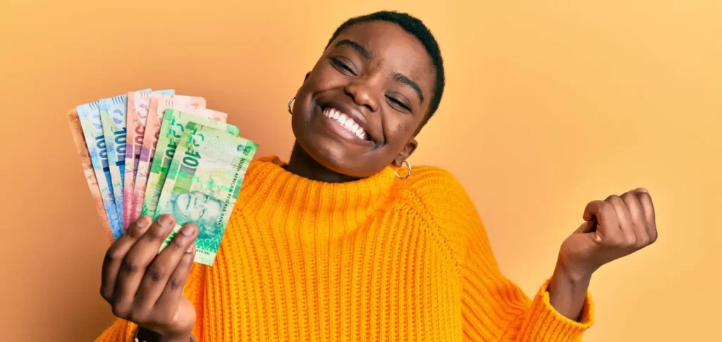 Young african american woman holding her holiday money that she got delivered.