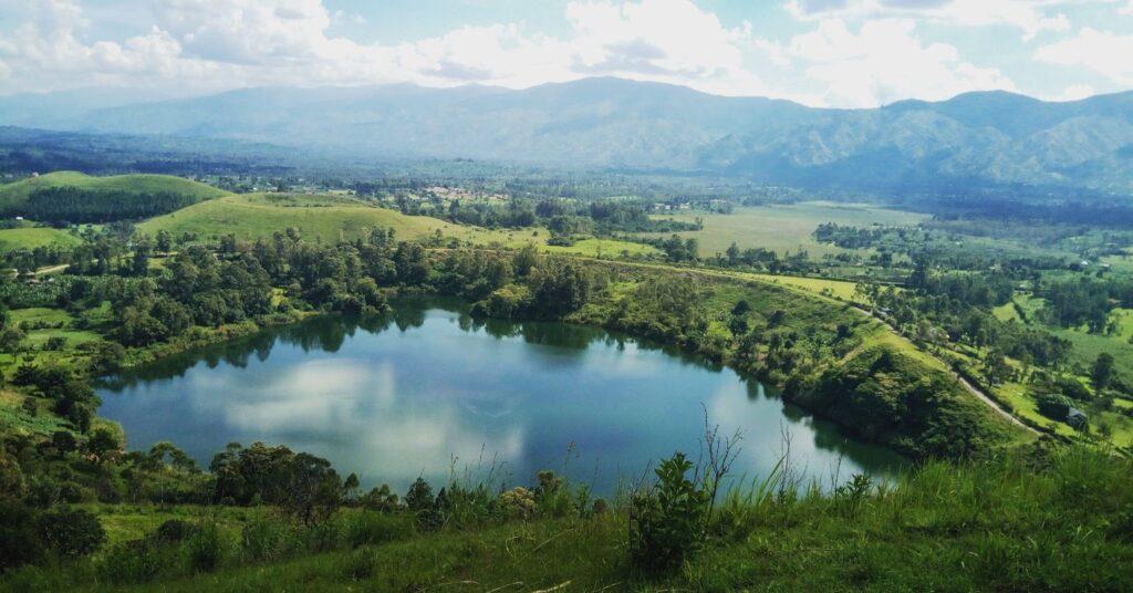 A view over looking mountains and a lake in Uganda. 
