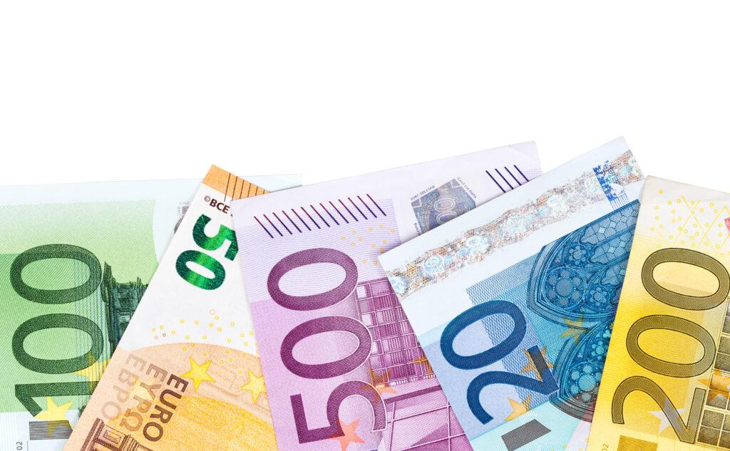 Euro banknotes on white background.