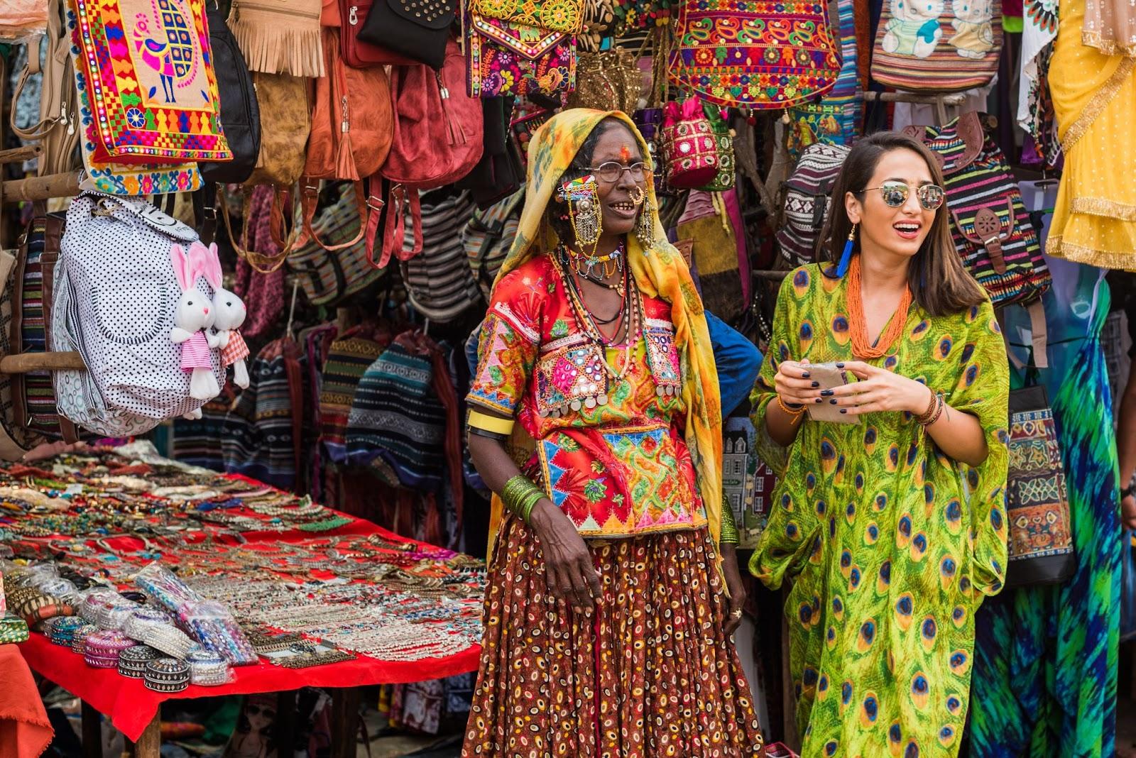 Street vendors selling goods and handicrafts to tourists at Anjuna Beach, Goa