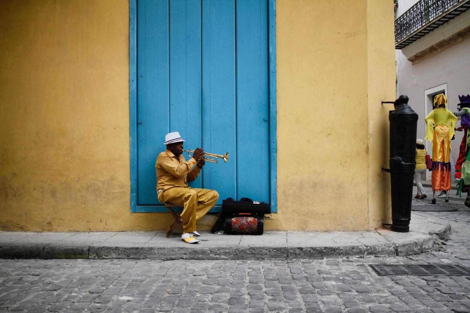 Cuban local playing the trumpet on the streets of Cuba. 