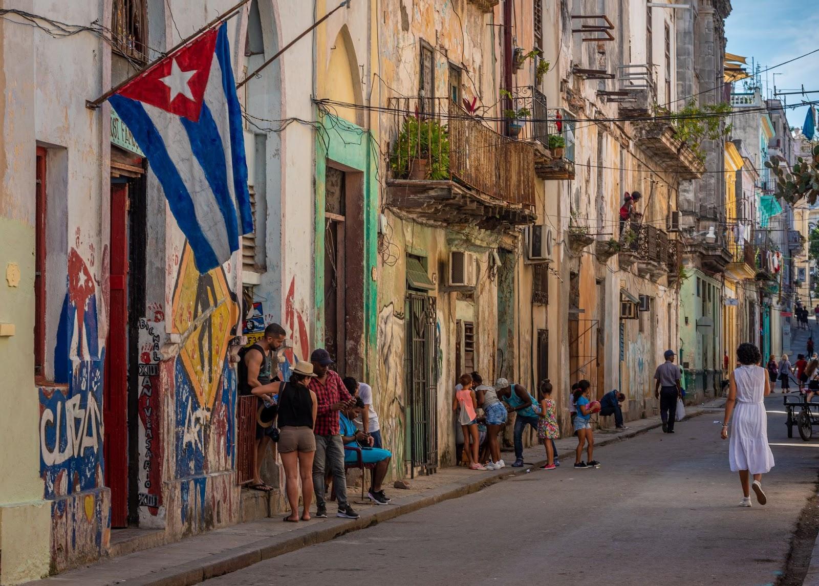 Cuban locals walking down the streets of Havana, Cuba.