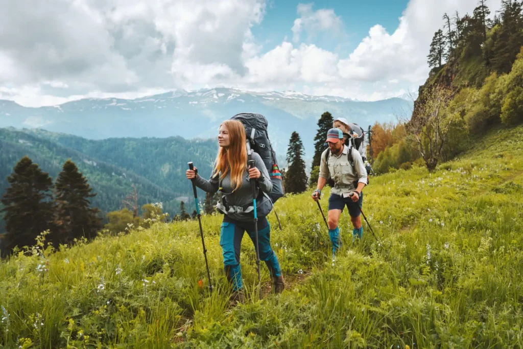 Eco conscious family hiking in mountains