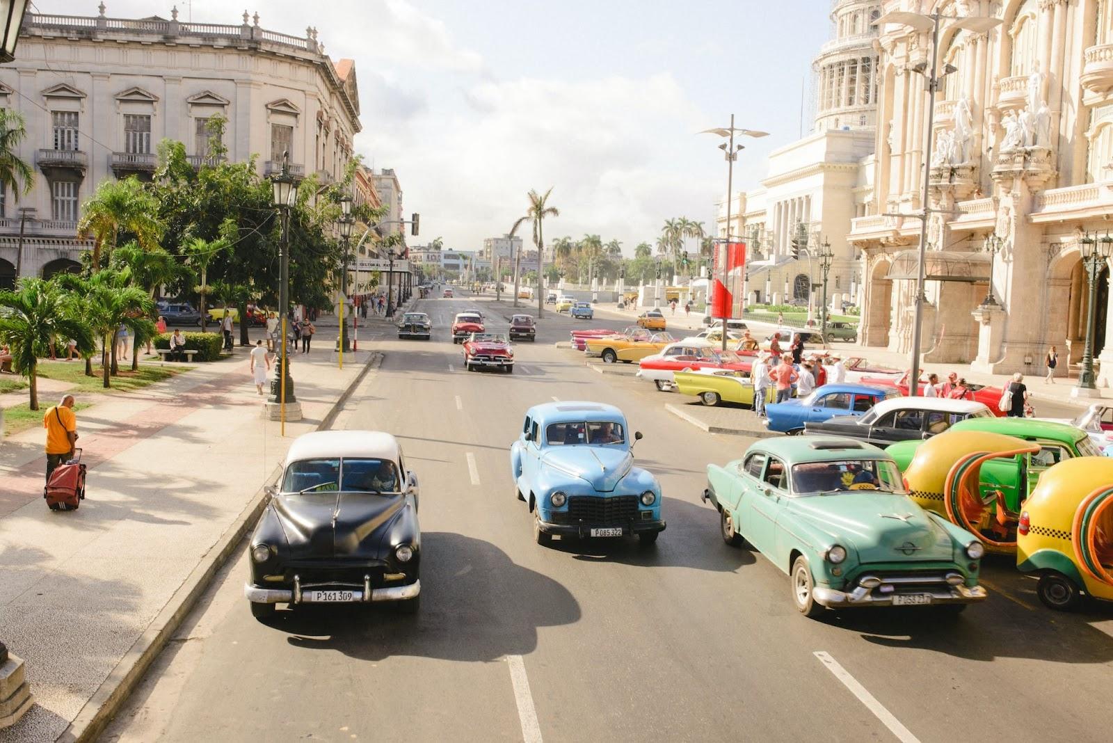 Streets and roads of Cuba with vintage cars.