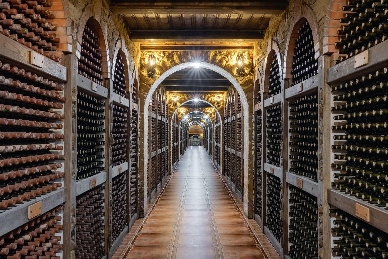 Wine bottles stacked up in underground wine cellar in Chisinau, Moldova