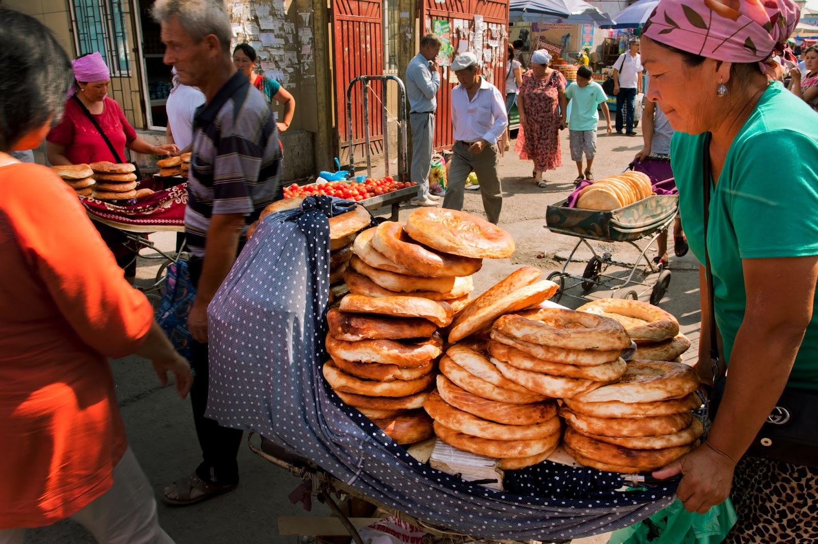 Women selling traditional Central Asian bread on the popular Osh market BISHKEK, KYRGYZSTAN