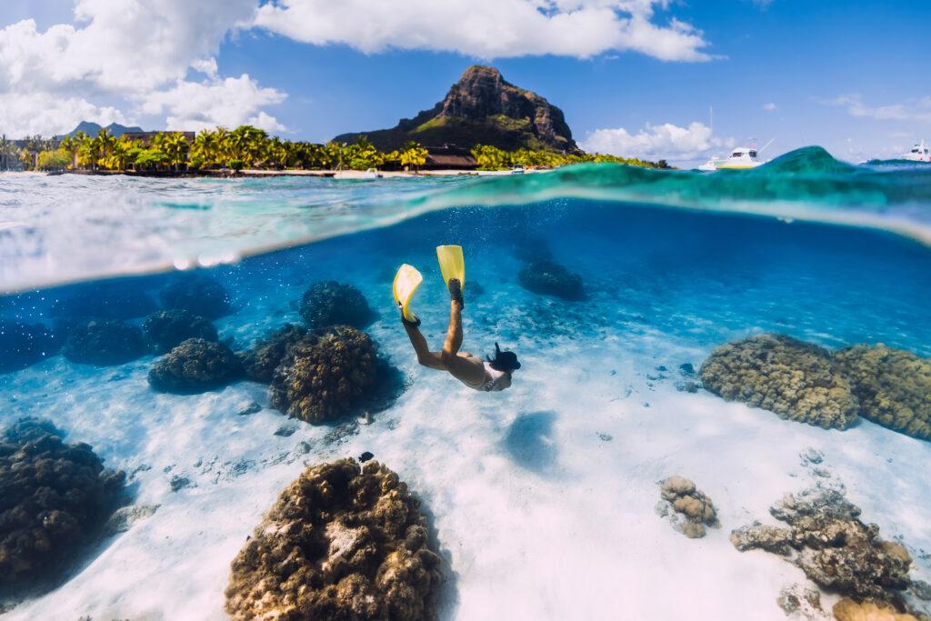 Lady freediving in the ocean in Mauritius.