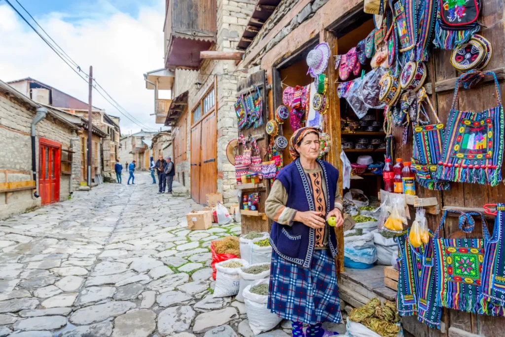 Lahich Azerbaijan View Over Local Street traditionally dressed stood outside her shop