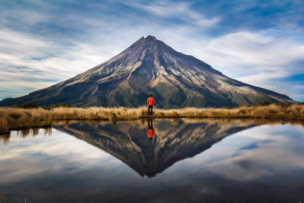 mountaineer  looking to the Taranaki volcano in the north island of New Zealand.