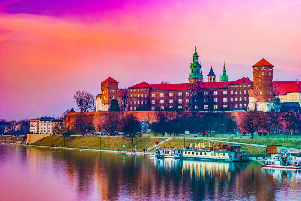 Royal castle of the Polish kings on the Wawel hill, over the Vistula river in beautiful sunset light, Krakow, Poland.