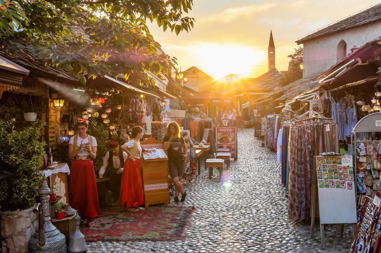 Cobbled street with cafes and souvenir shops in old town of Mostar