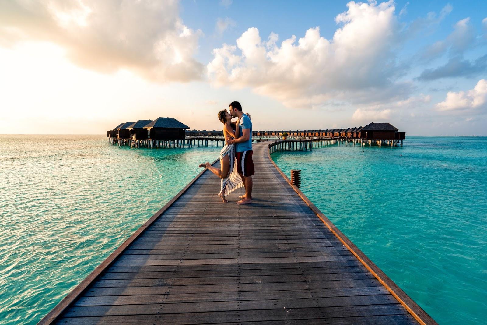 A couple enjoying a sunrise in the Maldives - valentines