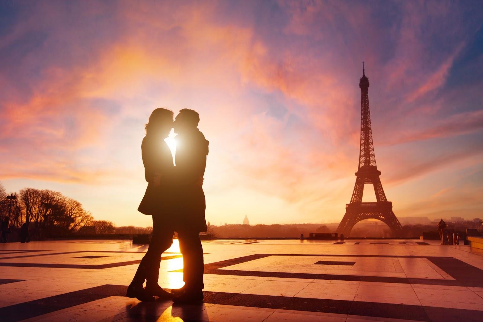 Paris, couple in love kissing near Eiffel tower, France - Valentines