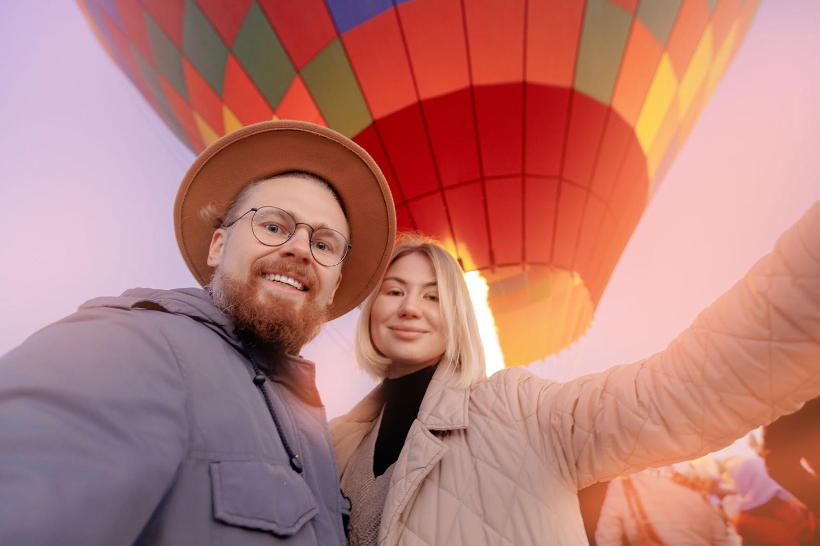 Couple taking a romantic hot air baloon ride for Valentines day