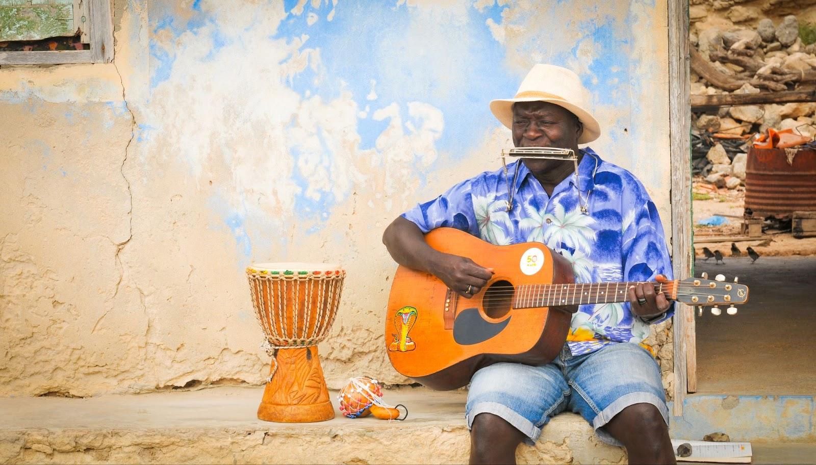 View of local people performing traditional music on the streets of Rabil on the island of Boa Vista, Cape Verde, Africa