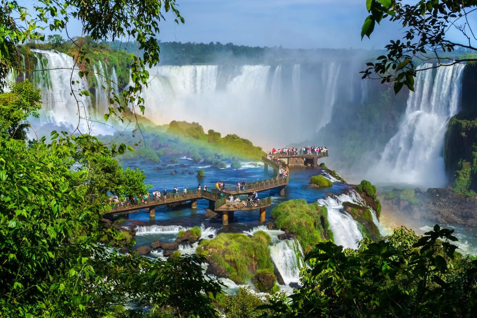 Tourists at Iguazu Falls, one of the world's great natural wonders, on the border of Brazil and Argentina.