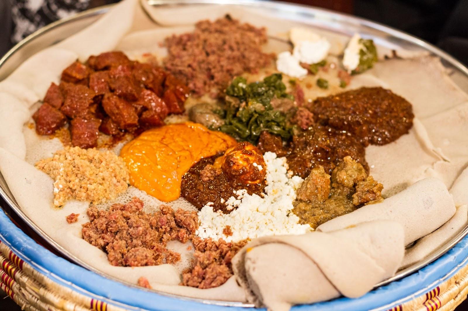 Traditional Ethiopian Food, Several types of stew and meat served on Injera