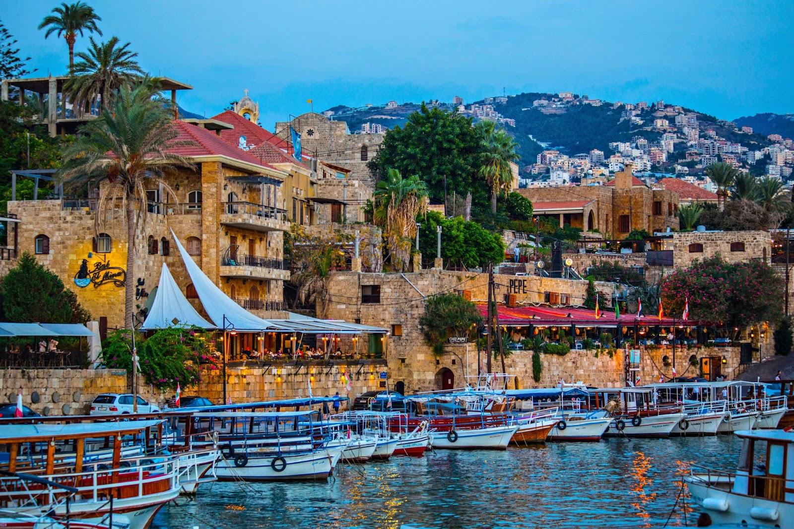 Historical houses and boats in the old port of Byblos, Lebanon