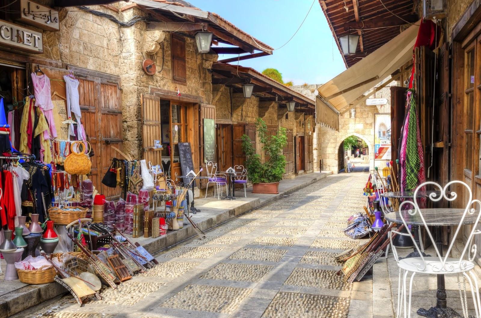 A view of the old pedestrian souk in Byblos, Lebanon during the day. A very medieval and picturesque area, paved with little stones and with little shops.