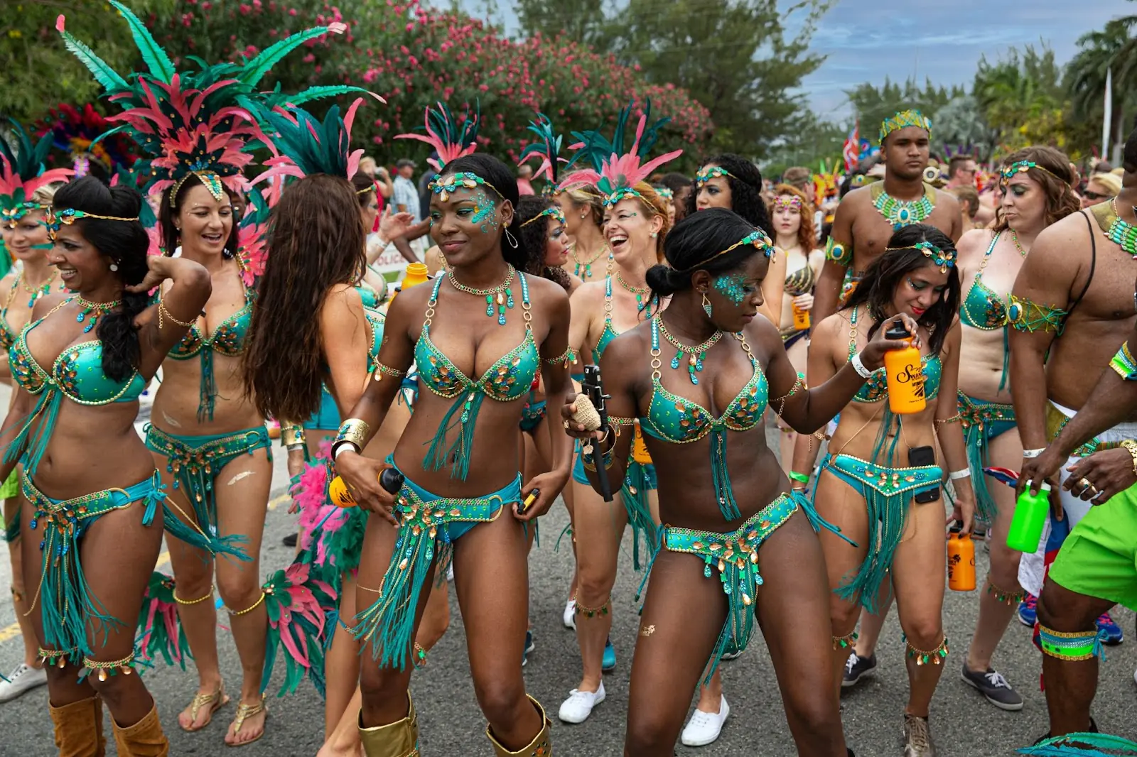 Seven Mile Beach, Grand Cayman, Cayman Islands, Caribbean. Masqueraders enjoy themselves in the Batabano Cayman Carnival.