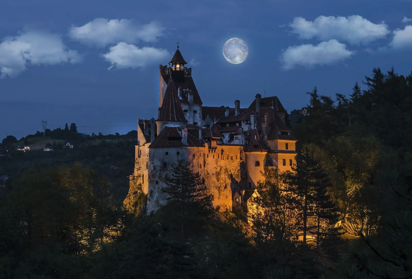 Dracula's medieval castle at night with full moon - Bran , Transylvania. Romania.