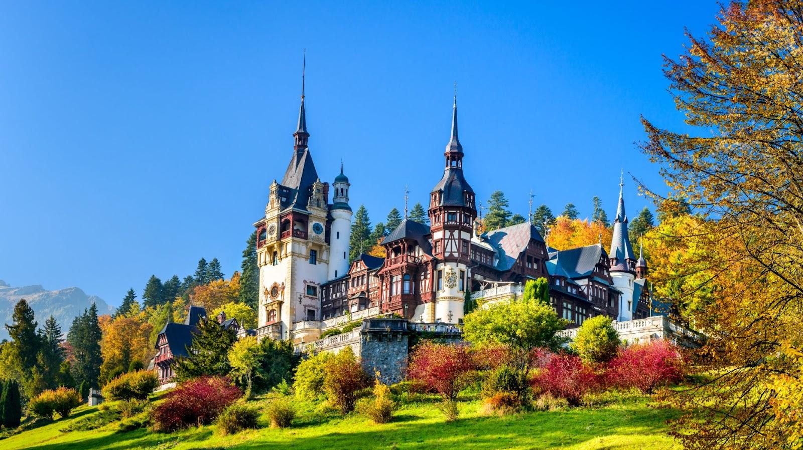 Peles Castle, Romania. Beautiful famous royal castle and ornamental garden in Sinaia landmark of Carpathian Mountains in Europe