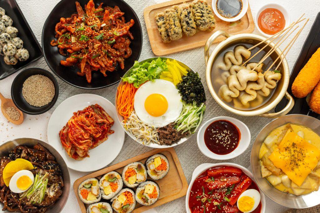 range of Korean foods served on a dining table.