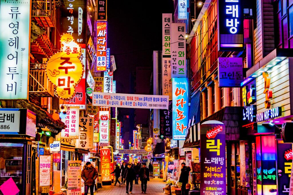 Colourful billboards on the street of Seoul at night.