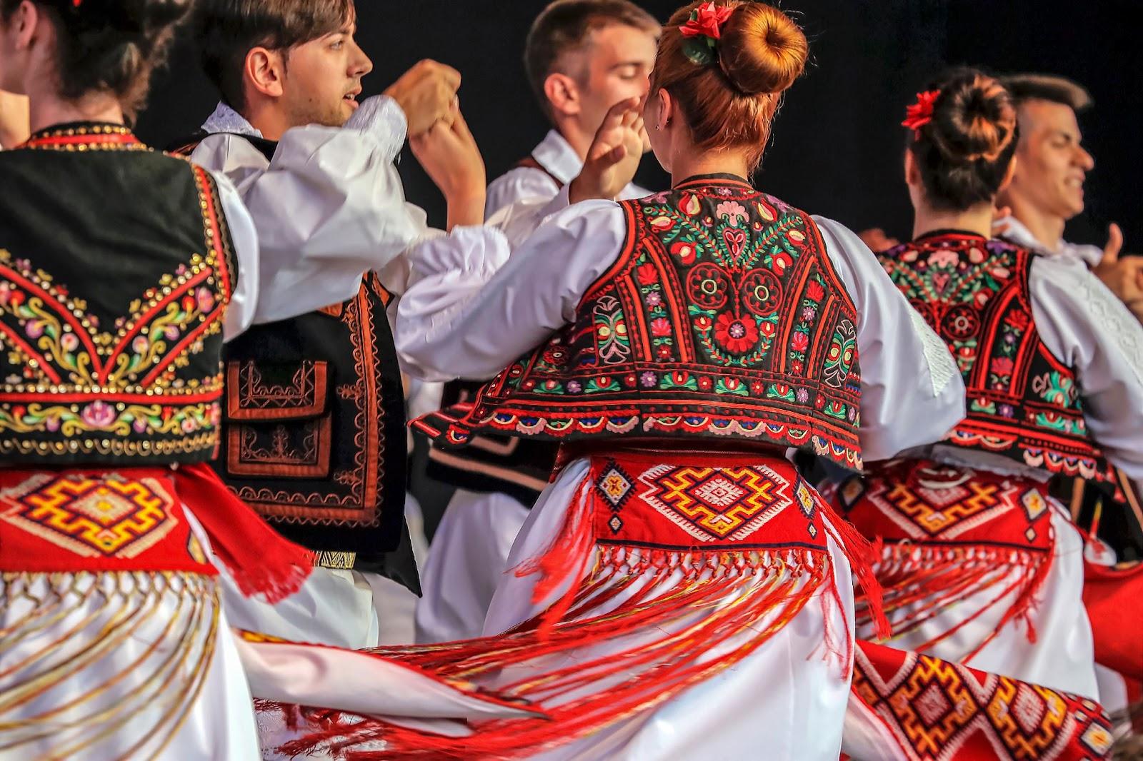 young Romanian dancers in traditional costume present at the international folk festival
