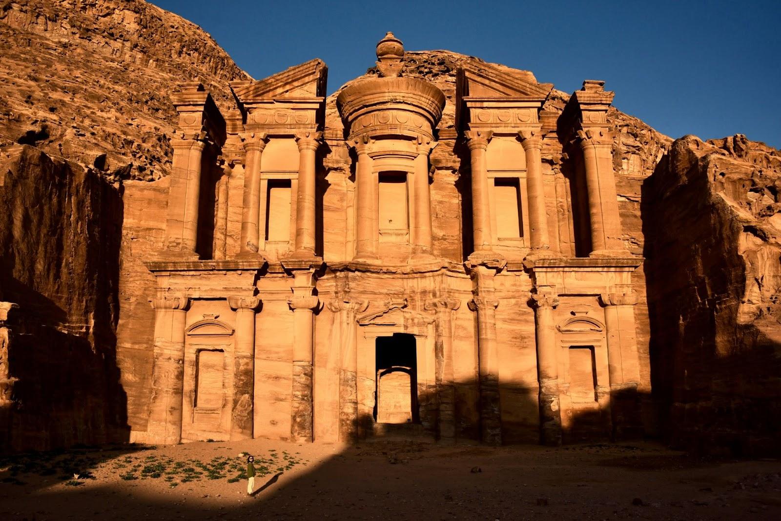 a large stone building in the middle of a desert Petra Jordan