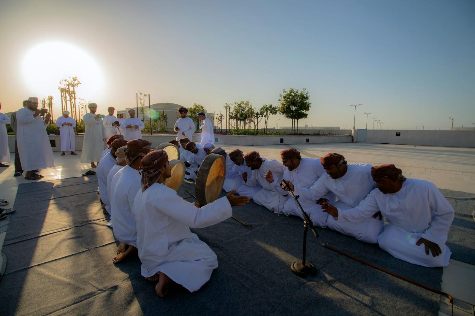 muscat, Oman, people playing instruments.