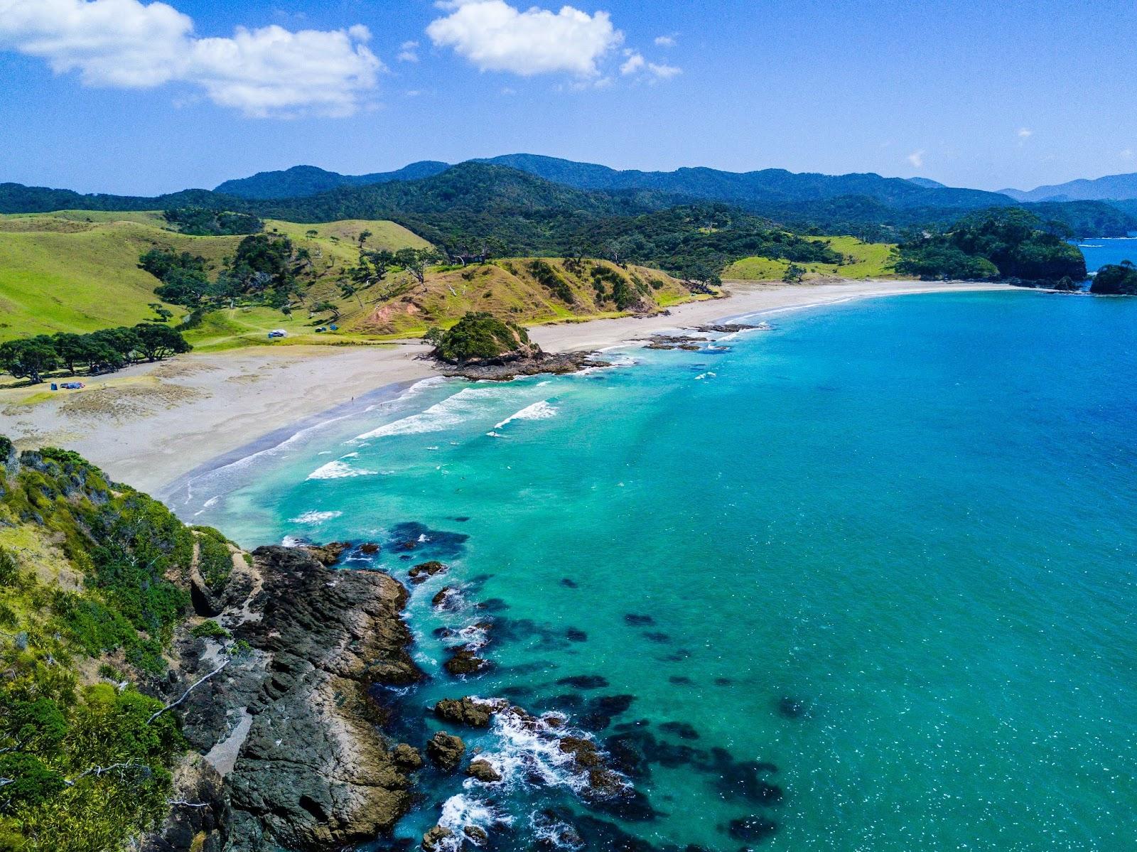 aerial view of New Zealand beach with mountains