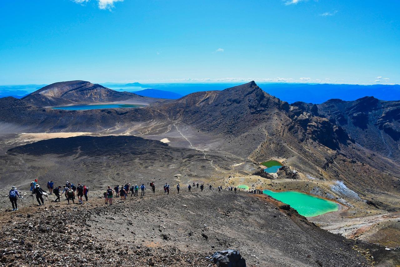 Tourists on a volcanic hike New Zealand
