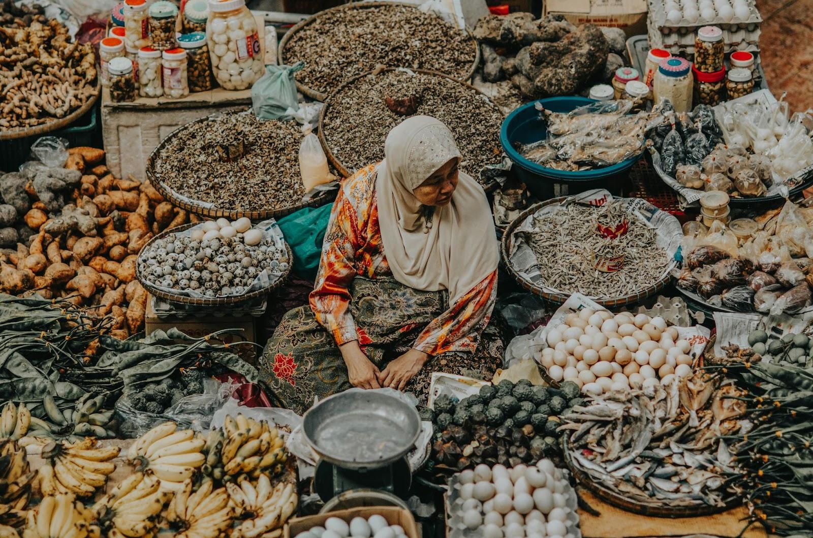 Old woman selling at the market at Kota Bharu, Malaysia.