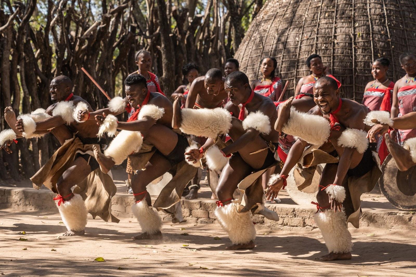singing, dancing and celebrating men from Eswatini